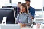 Software developer working with computer in the modern startup o